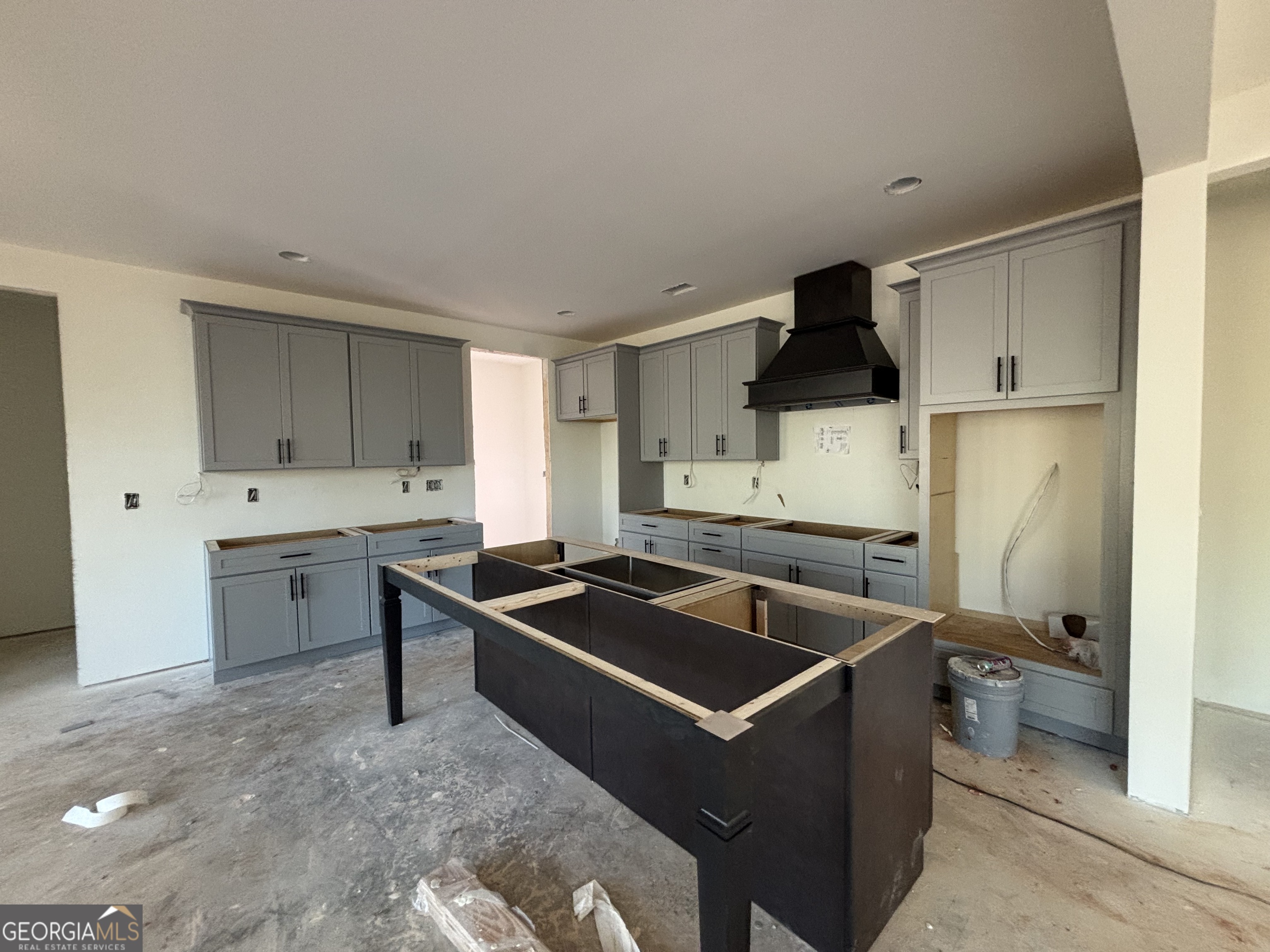 131 Hawthorne Lane Forsyth, GA 31029 - Photo 5 of 14 a kitchen that has a sink and a stove in it