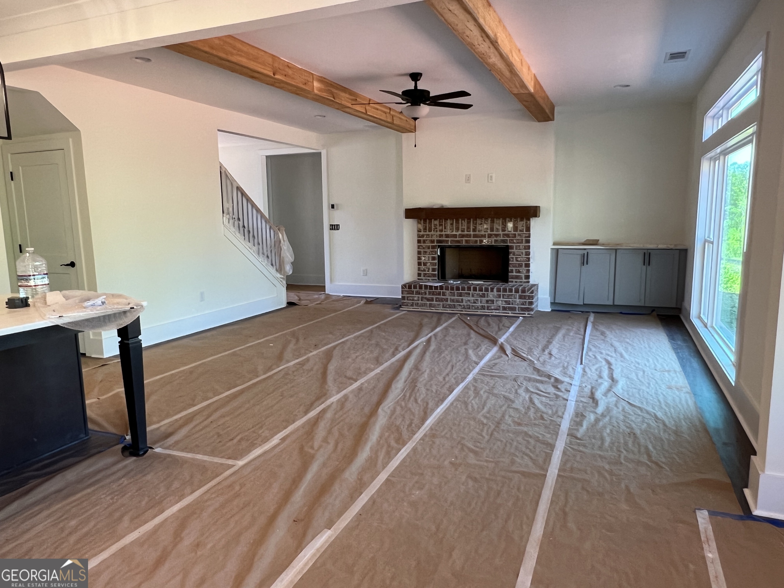 131 Hawthorne Lane Forsyth, GA 31029 - Photo 5 of 31 a view of an empty room with a fireplace and a window