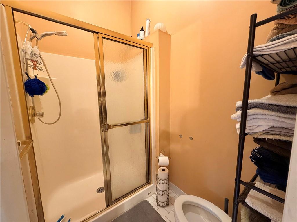426 Pates Lake Court Hampton, GA 30228 - Photo 27 of 60 a bathroom with a shower and a toilet