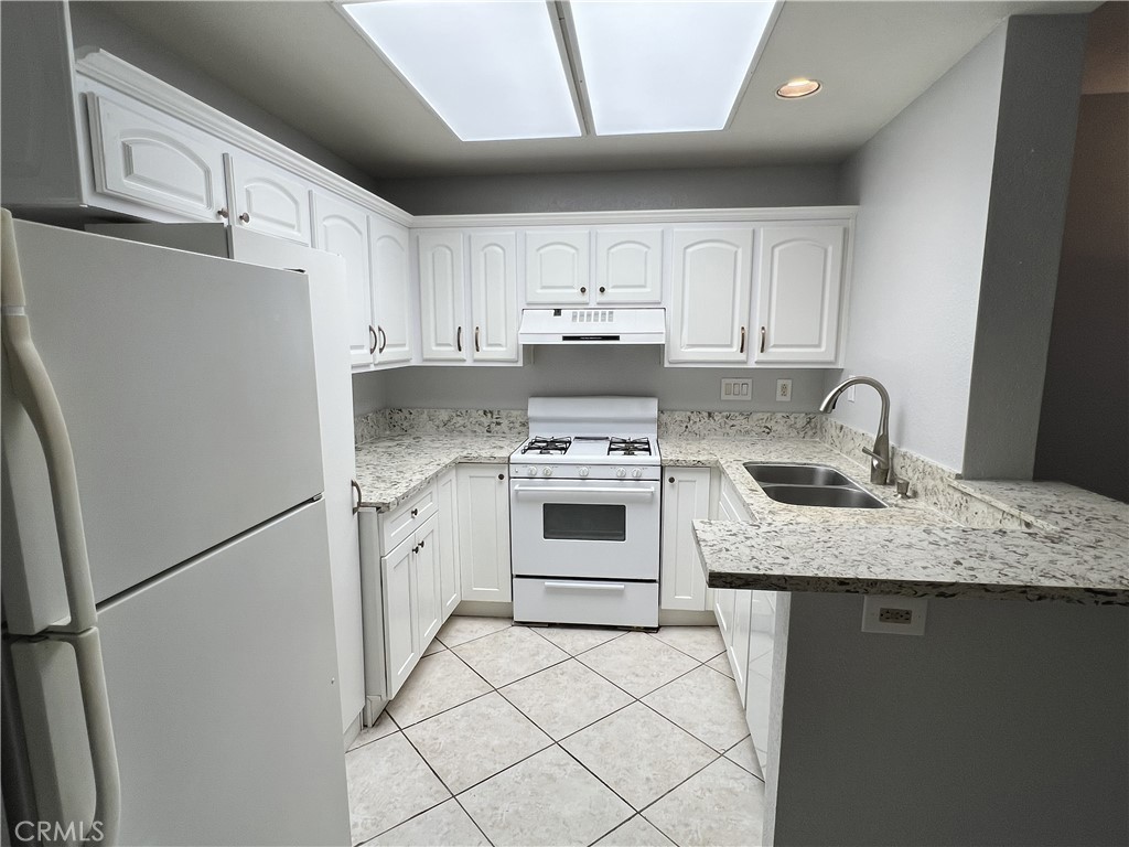 85 Castano Rancho Santa Margarita, CA 92688 - Photo 13 of 35 a kitchen with cabinets appliances and a sink