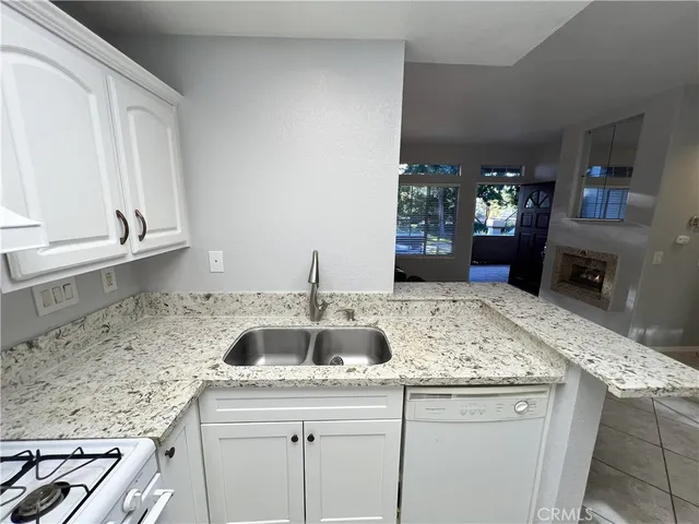 a kitchen with a sink and cabinets