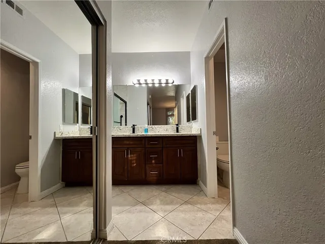 a bathroom with a sink and a large mirror