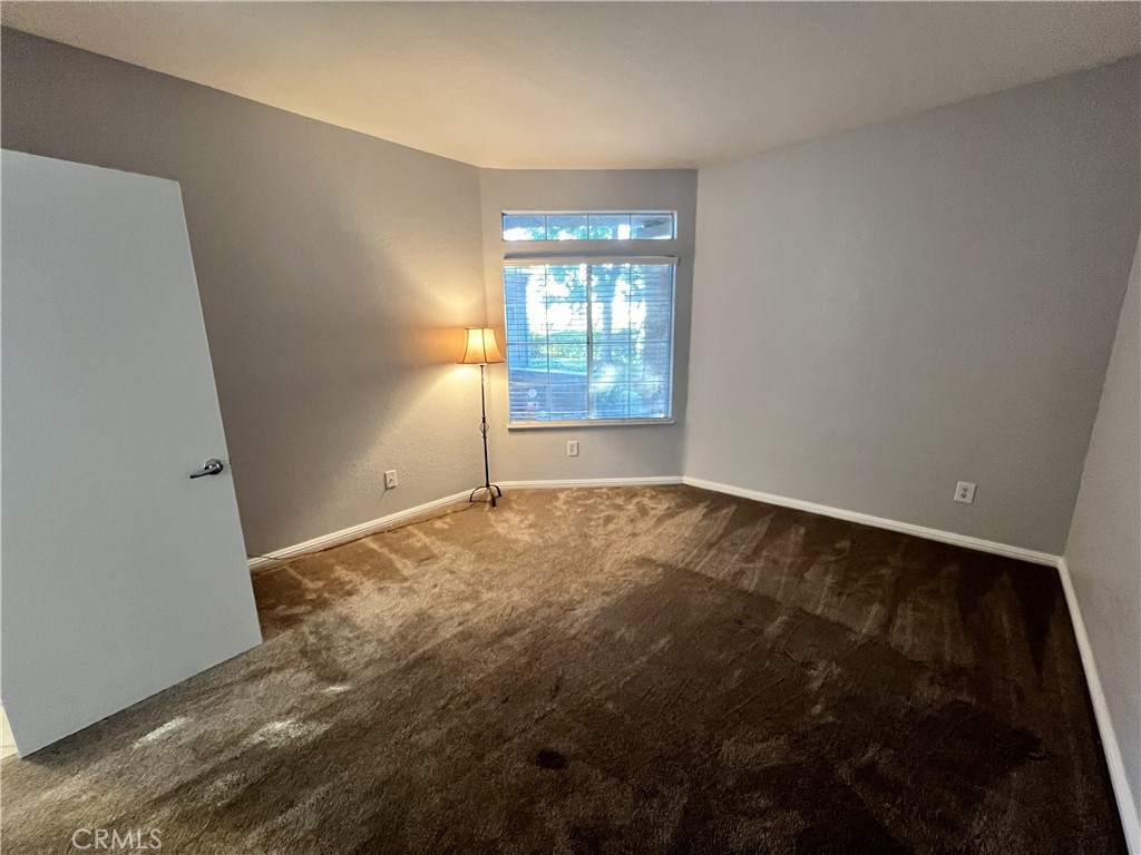 85 Castano Rancho Santa Margarita, CA 92688 - Photo 25 of 35 an empty room with wooden floor and windows