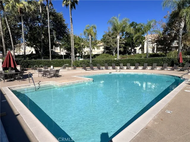 a view of a chairs and table in the patio
