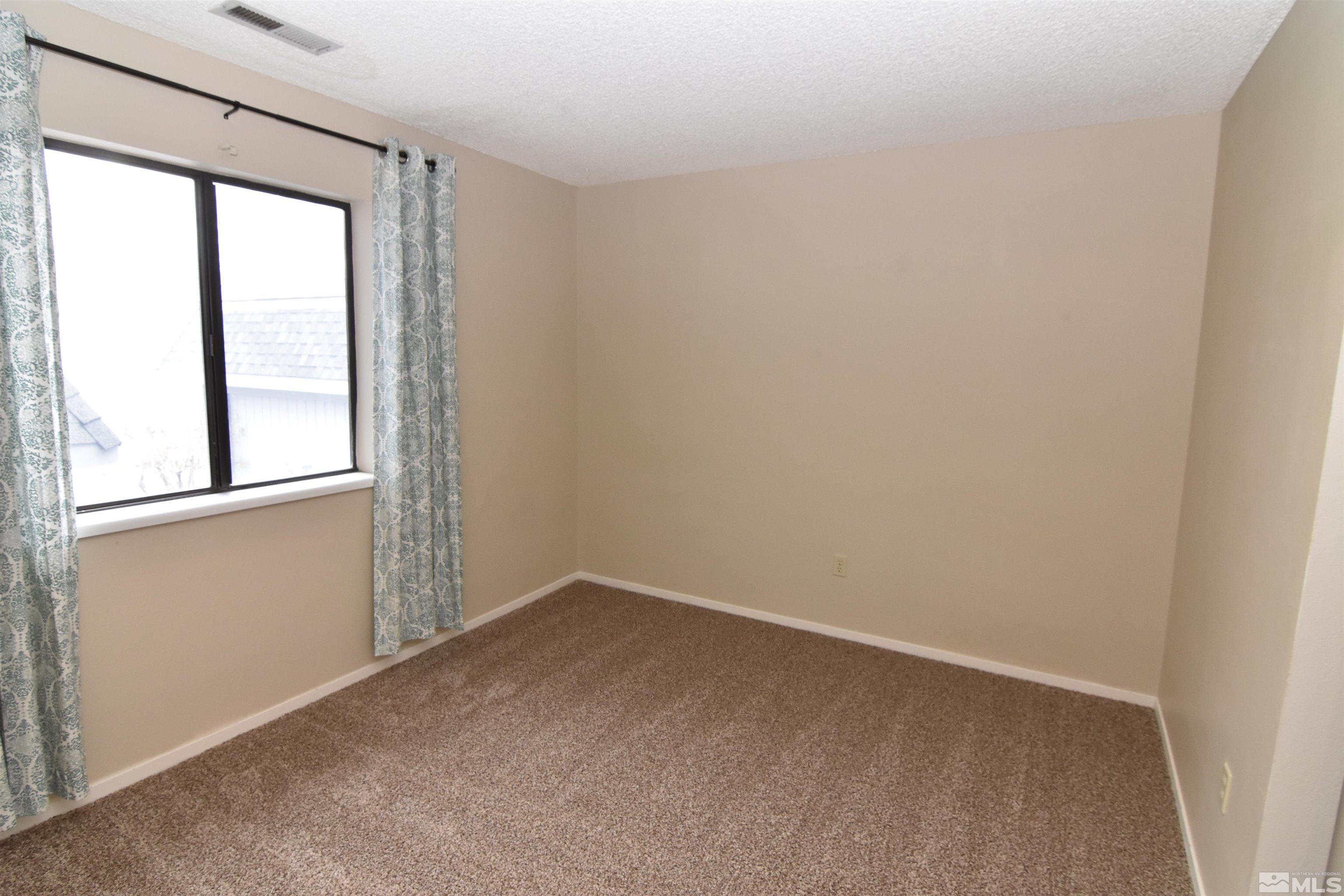 3945 Kings Row Reno, NV 89503 - Photo 11 of 19 an empty room with a window