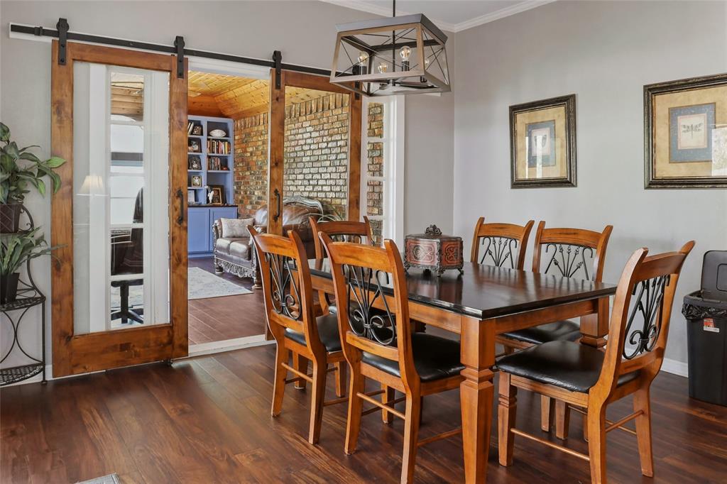 613 Regina Drive Hewitt, TX 76643 - Photo 23 of 33 a view of a dining room with furniture and wooden floor