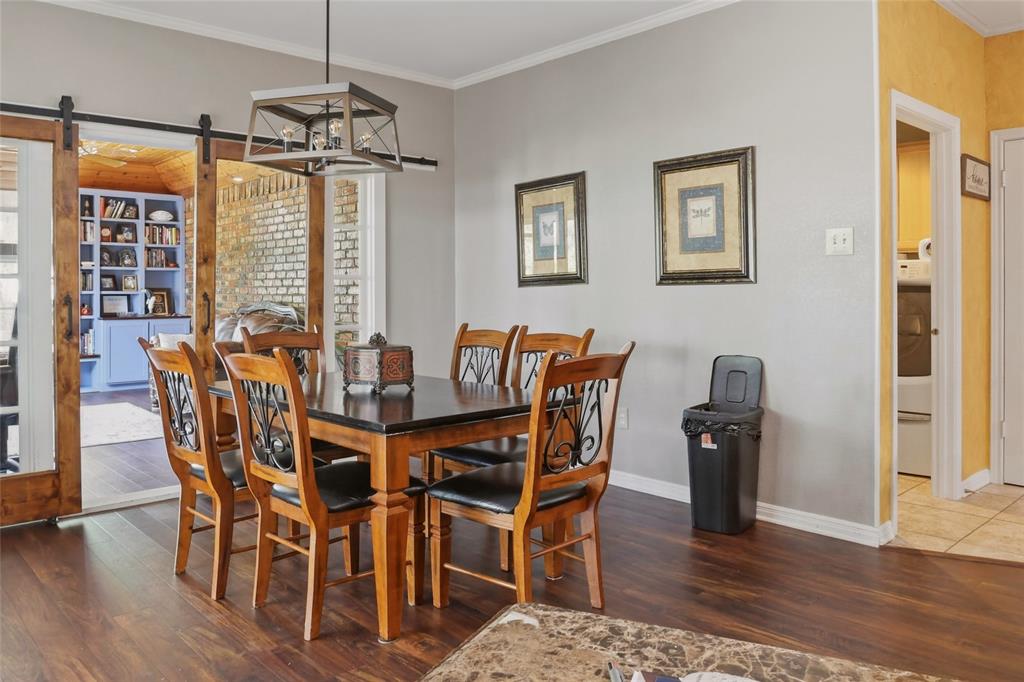 613 Regina Drive Hewitt, TX 76643 - Photo 25 of 33 a view of a dining room with furniture window and wooden floor