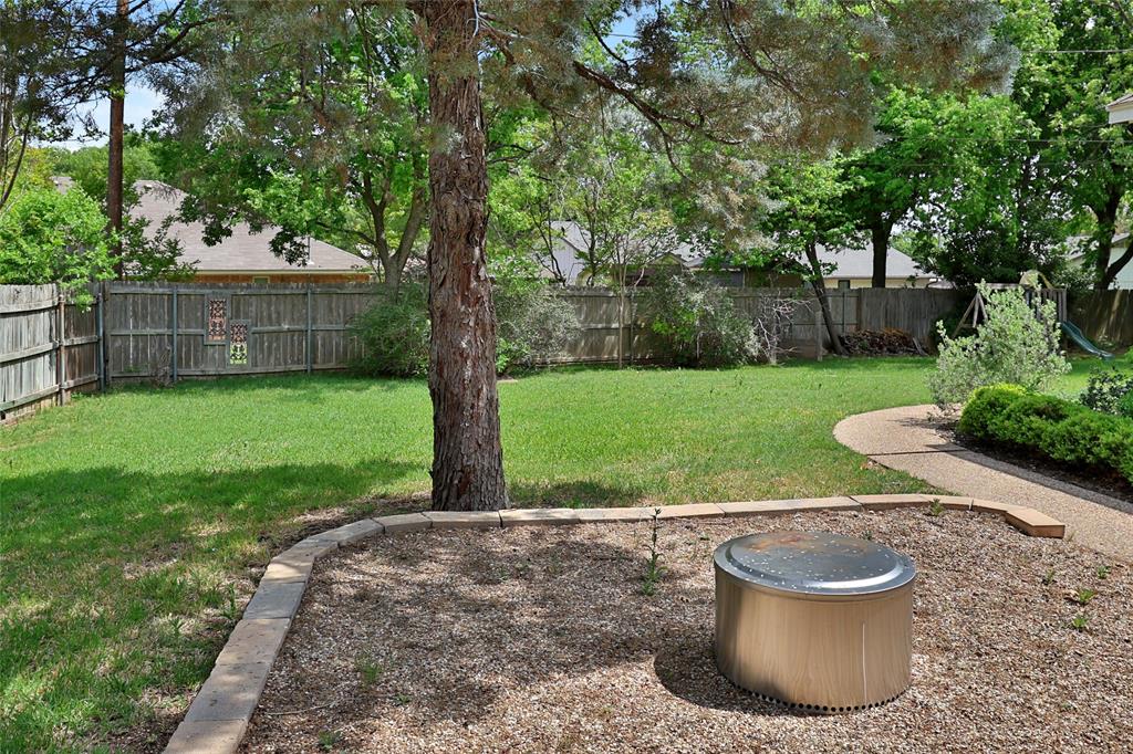 613 Regina Drive Hewitt, TX 76643 - Photo 10 of 33 a view of a backyard with large trees