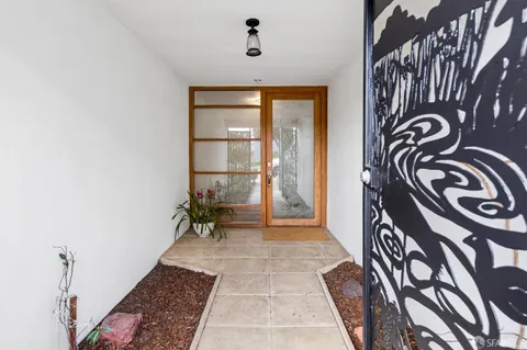 a view of a hallway with a couch
