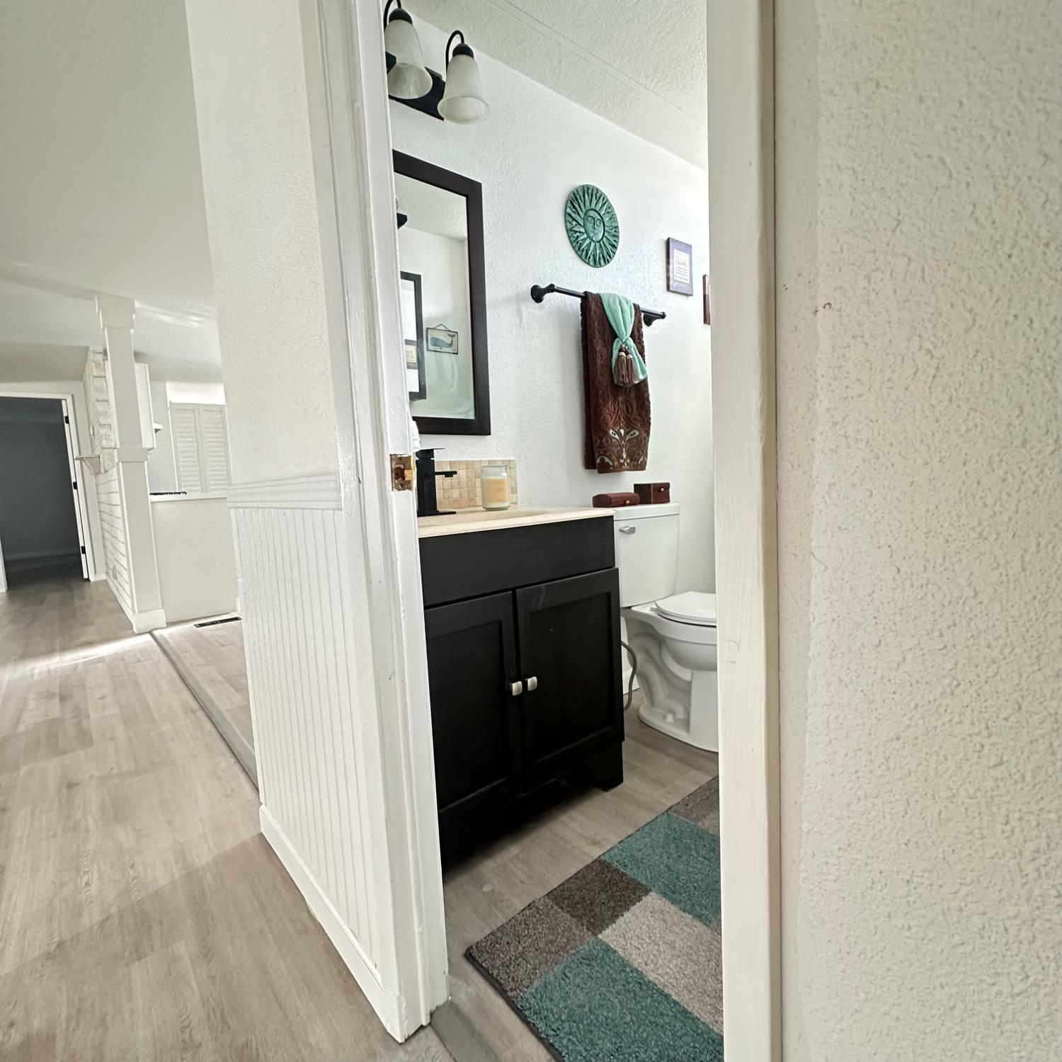 812 West Clover Road, Unit 66 Tracy, CA 95376 - Photo 17 of 27 Hallway bathroom on side with the two other bedrooms.