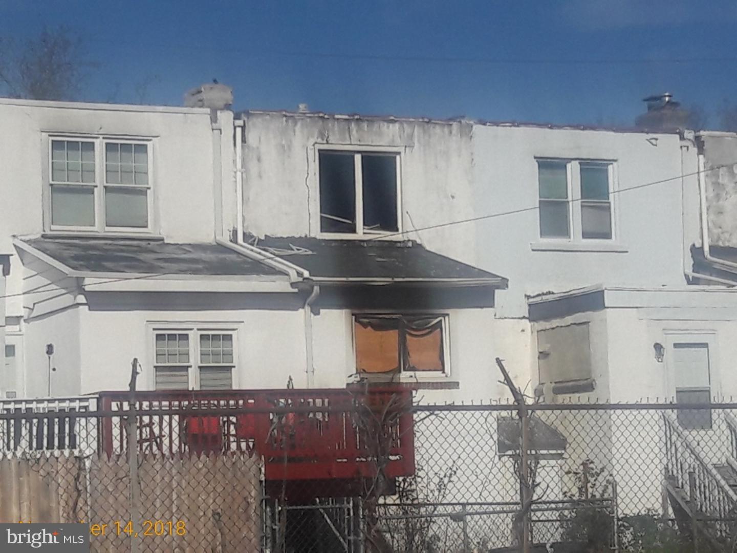 1260 South Merrimac Road Camden, NJ 08104 - Photo 3 of 4 a front view of a house with a garage
