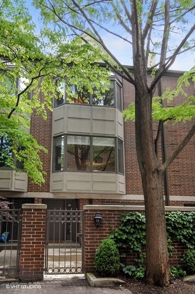 55 West Goethe Street, Unit 1223 Chicago, IL 60610 - Photo 1 of 31 a view of a house with a tree