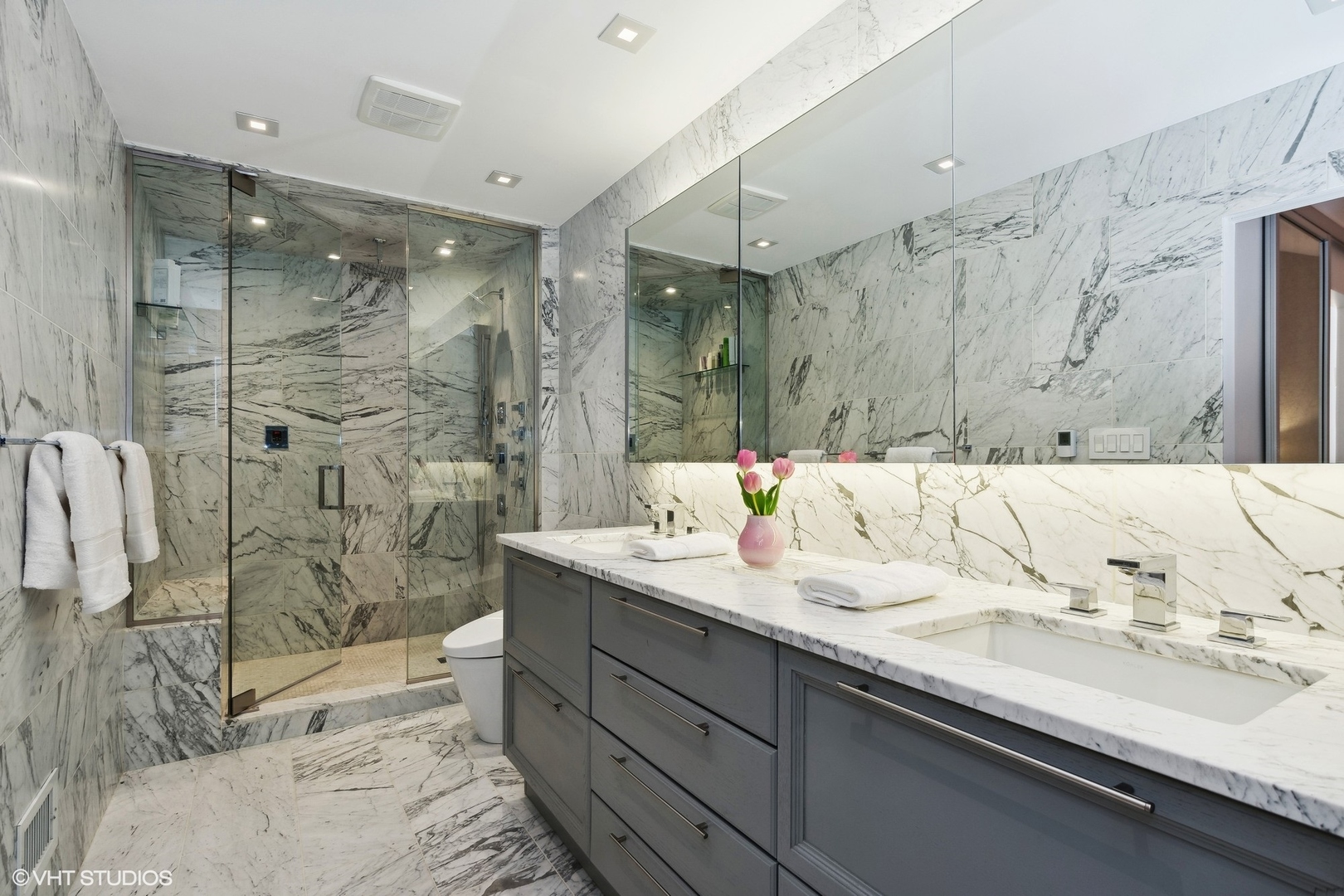 55 West Goethe Street, Unit 1223 Chicago, IL 60610 - Photo 18 of 31 a bathroom with a granite countertop sink mirror and shower
