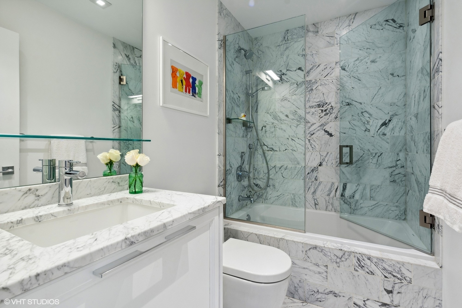 55 West Goethe Street, Unit 1223 Chicago, IL 60610 - Photo 23 of 31 a bathroom with a granite countertop sink a toilet and shower