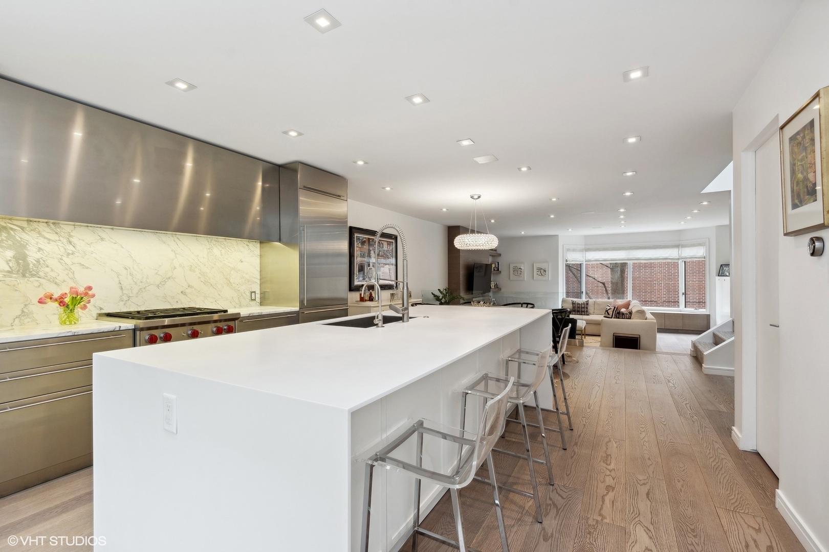 55 West Goethe Street, Unit 1223 Chicago, IL 60610 - Photo 6 of 31 a kitchen with a sink a stove and chairs