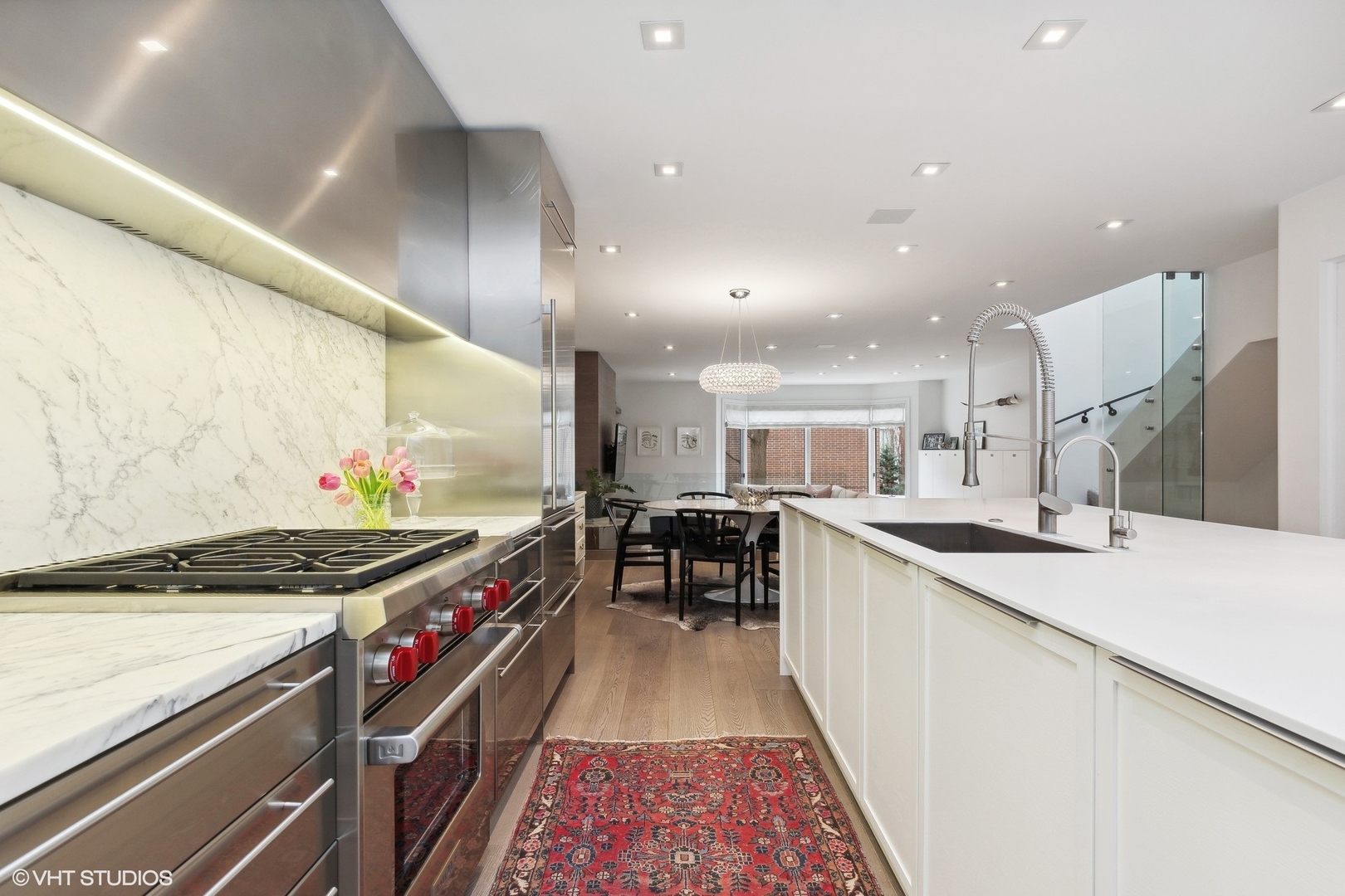 55 West Goethe Street, Unit 1223 Chicago, IL 60610 - Photo 7 of 31 a kitchen with stainless steel appliances granite countertop a stove a sink and a refrigerator