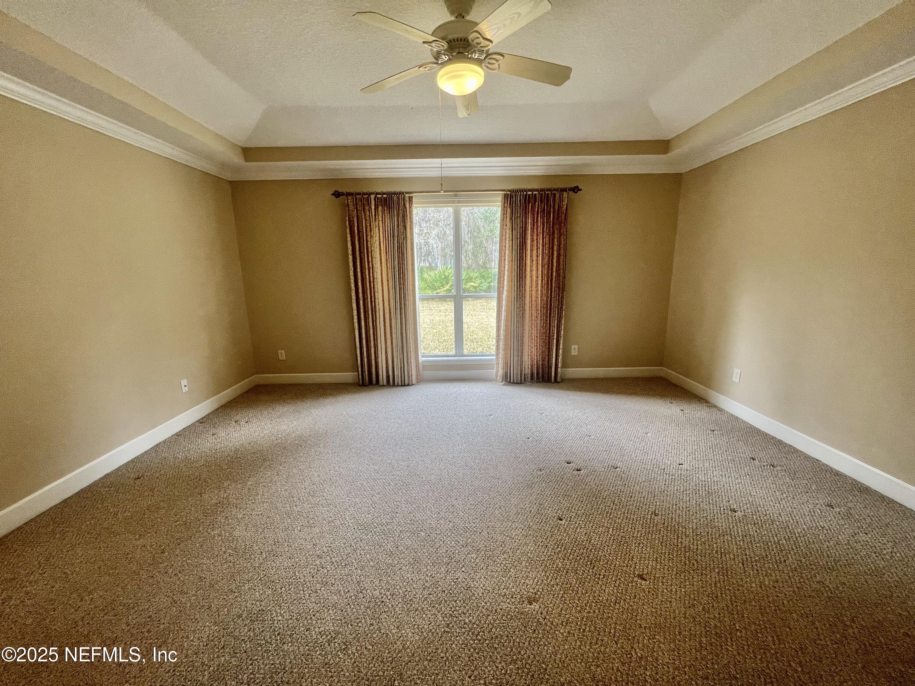 2284 Emilys Way Fleming Island, FL 32003 - Photo 19 of 36 a view of a livingroom with a ceiling fan and window