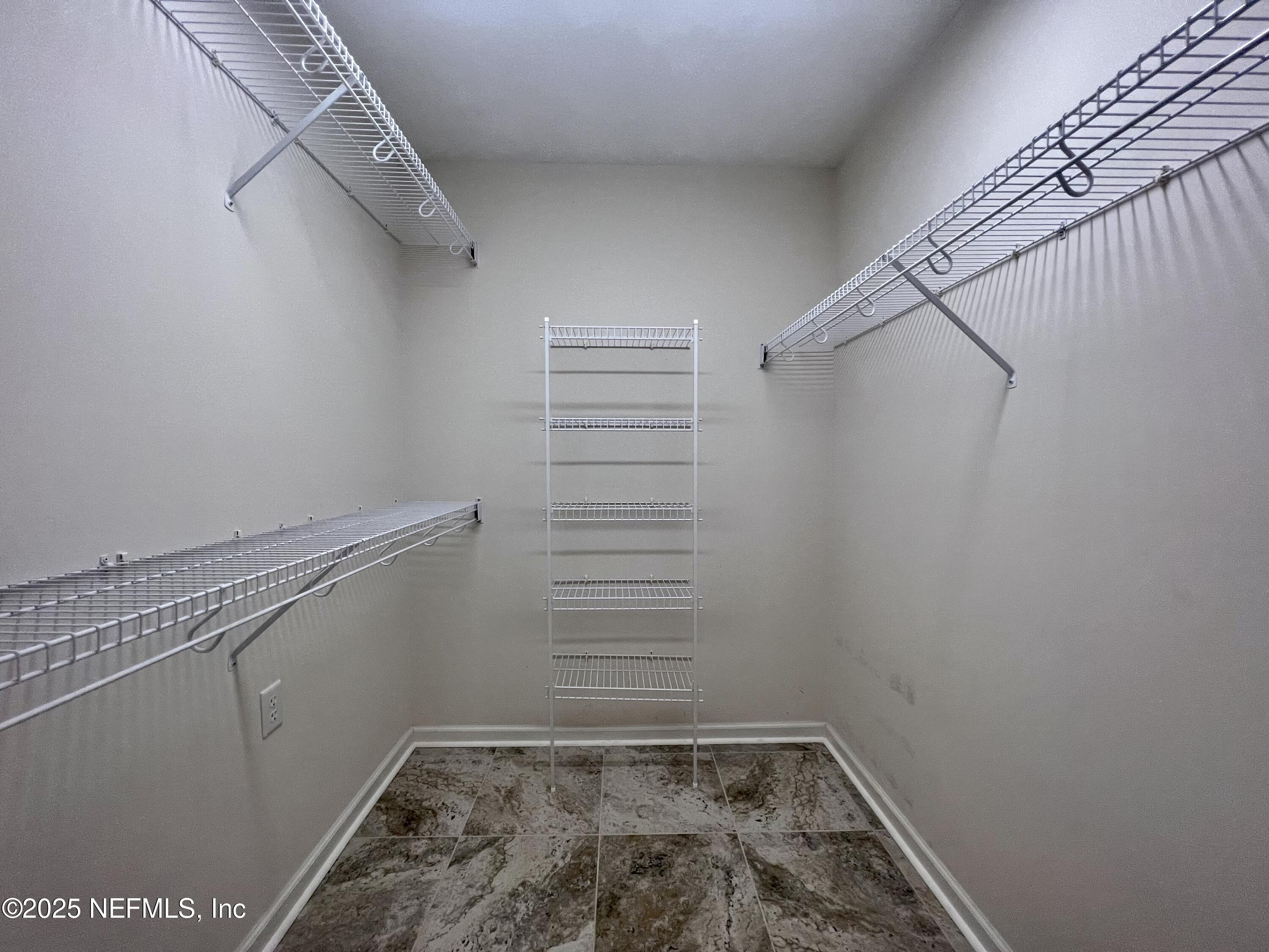 2284 Emilys Way Fleming Island, FL 32003 - Photo 21 of 36 a view of a room with racks on the wall