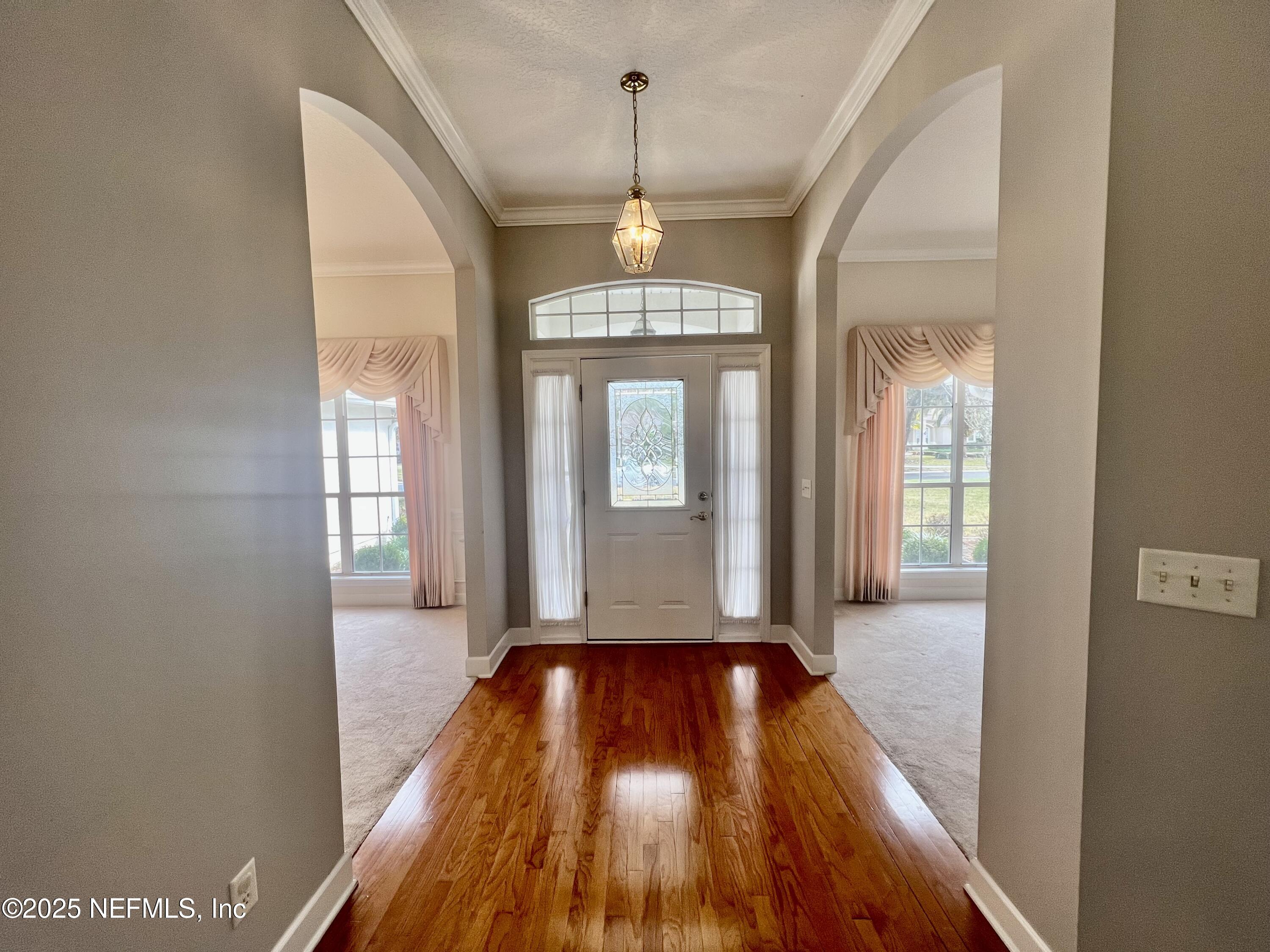 2284 Emilys Way Fleming Island, FL 32003 - Photo 4 of 36 a view of livingroom with hardwood floor and window