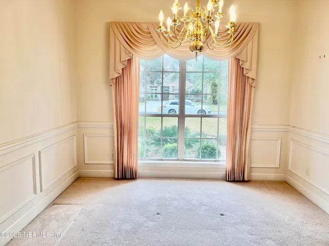 a bathroom with a tub and a window