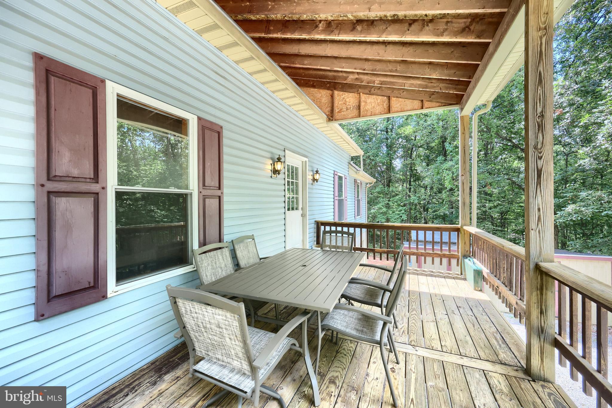 6031 Mountain Road Dover, PA 17315 - Photo 11 of 47 a view of balcony with furniture and wooden deck