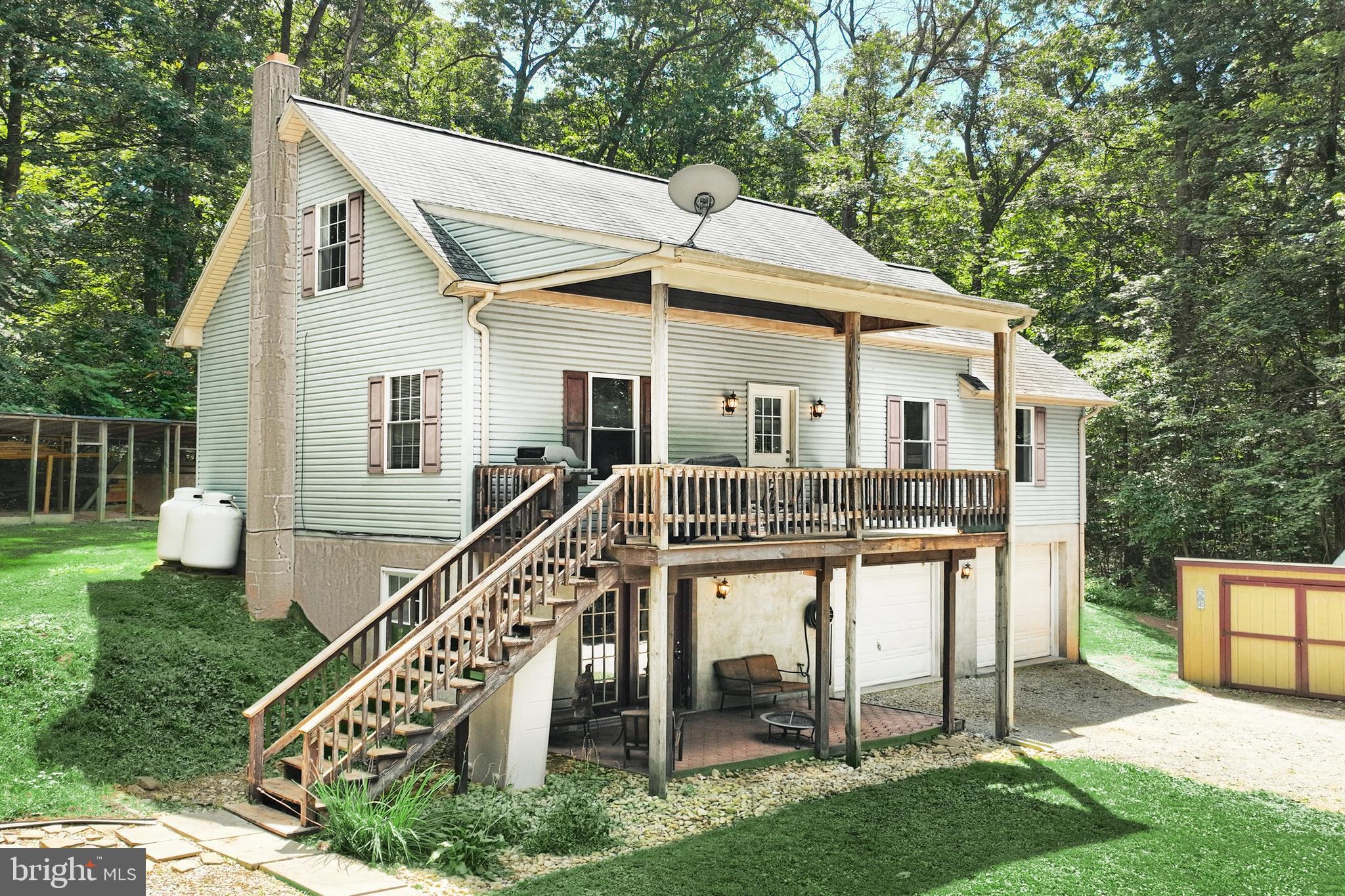 6031 Mountain Road Dover, PA 17315 - Photo 2 of 47 a view of house with a yard and deck