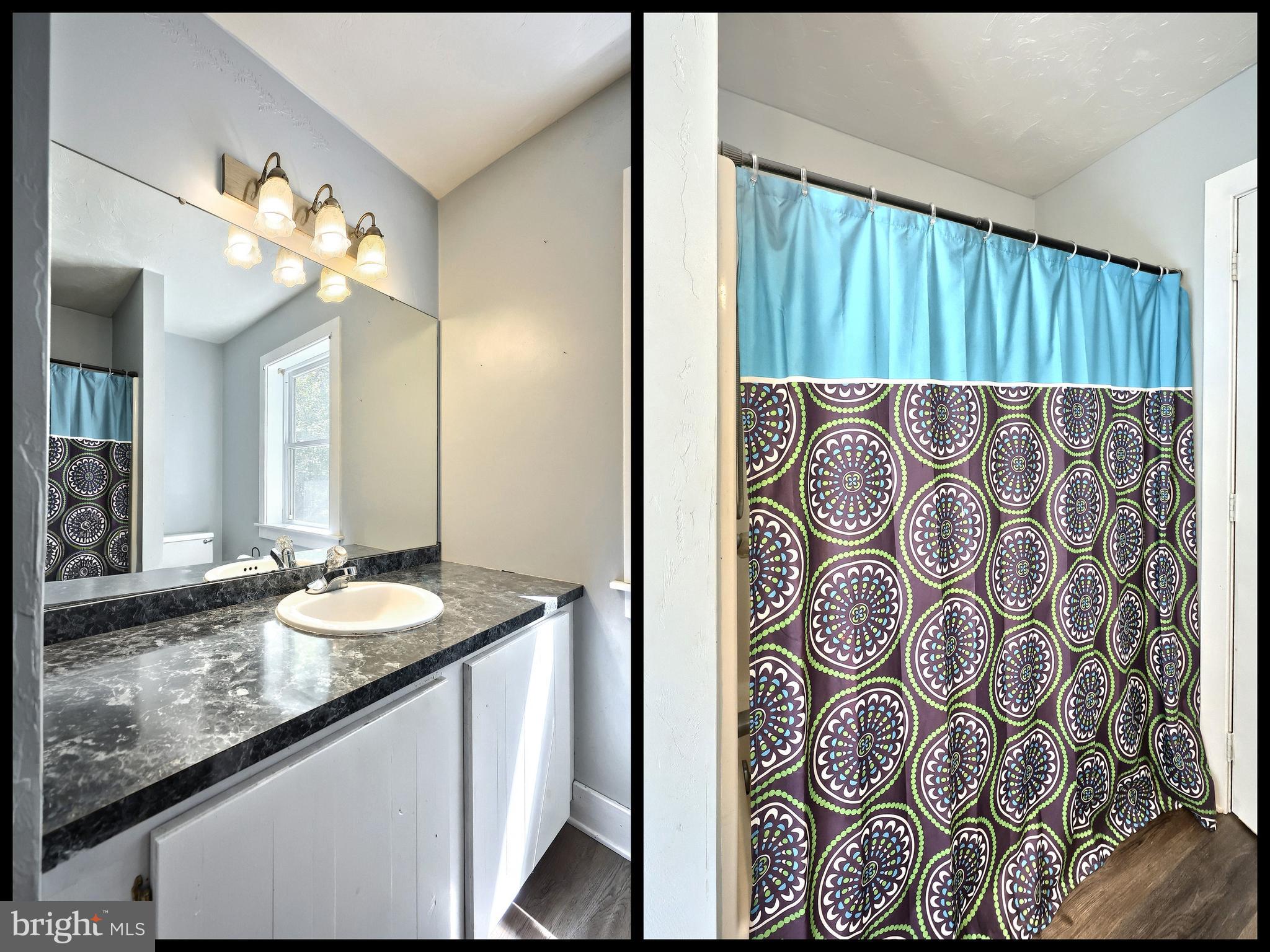 6031 Mountain Road Dover, PA 17315 - Photo 31 of 47 a bathroom with a granite countertop sink and a mirror