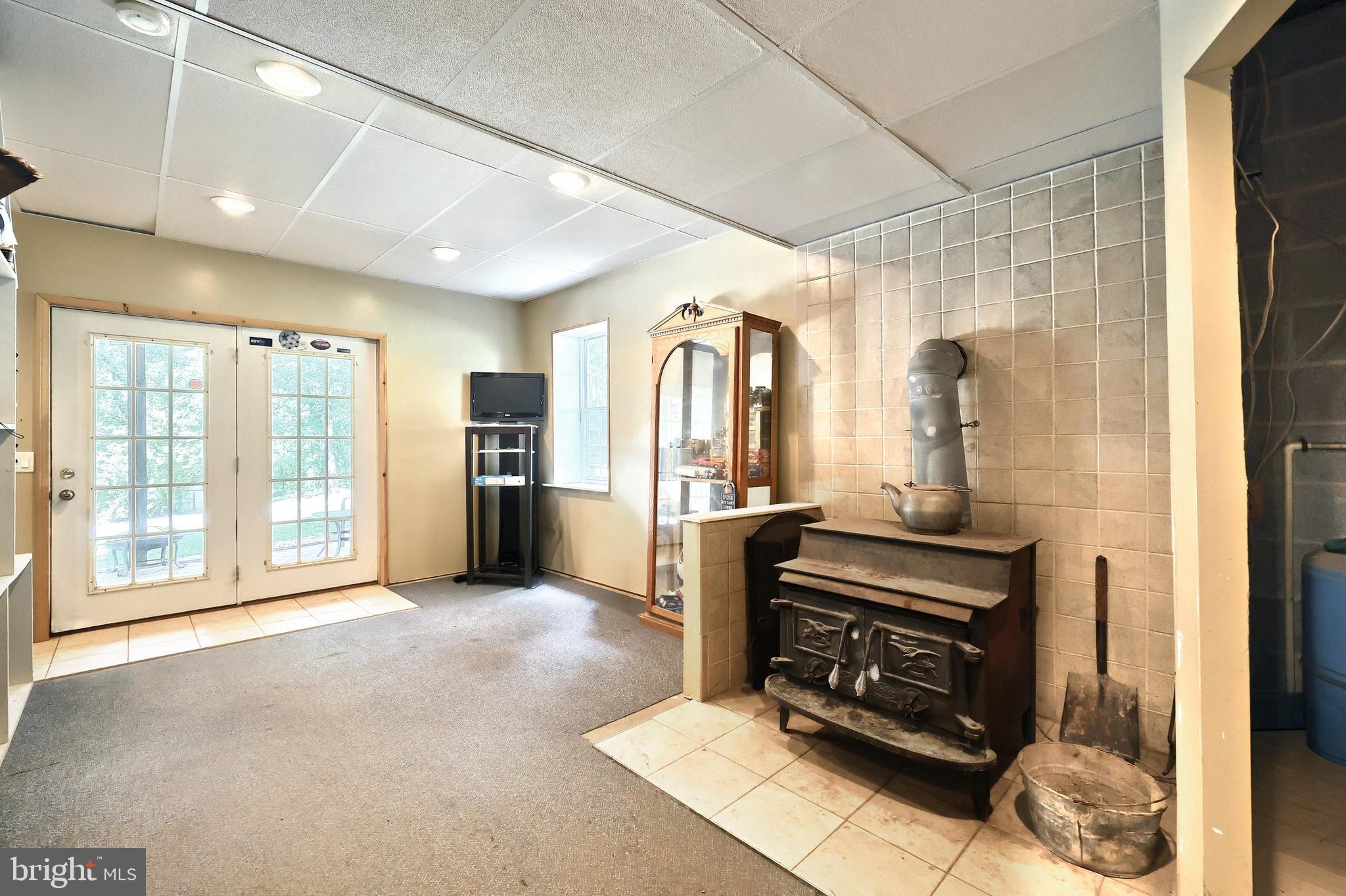 6031 Mountain Road Dover, PA 17315 - Photo 38 of 47 a view of an empty room with a fireplace and a window