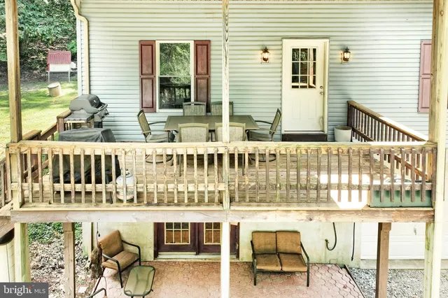 a balcony with table and chairs