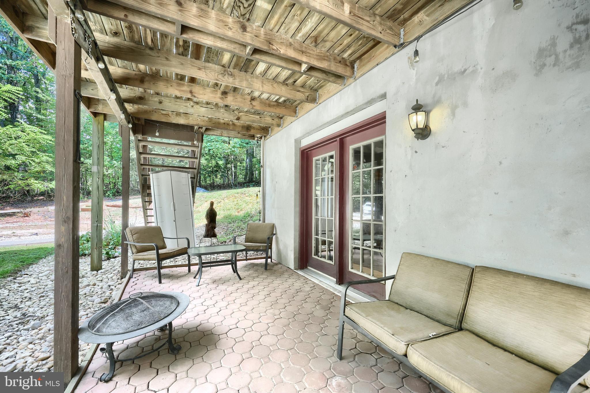 6031 Mountain Road Dover, PA 17315 - Photo 10 of 47 a balcony with furniture and a potted plant