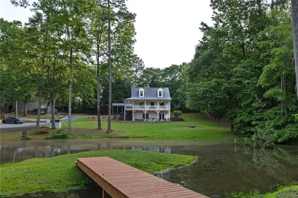 a view of a wooden deck and garden
