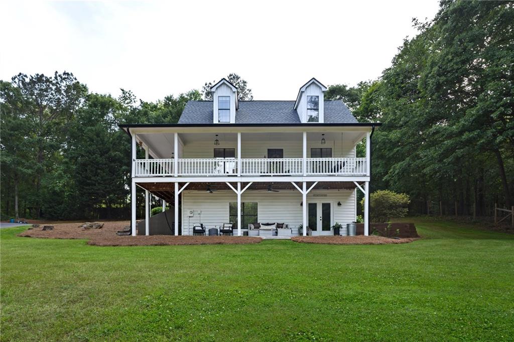 2700 Jack Glass Road Monroe, GA 30656 - Photo 2 of 48 front view of a house with a big yard