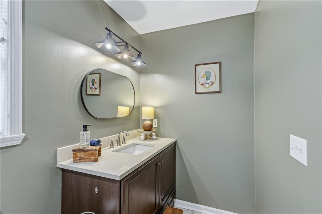 2700 Jack Glass Road Monroe, GA 30656 - Photo 22 of 48 a bathroom with a sink and a mirror