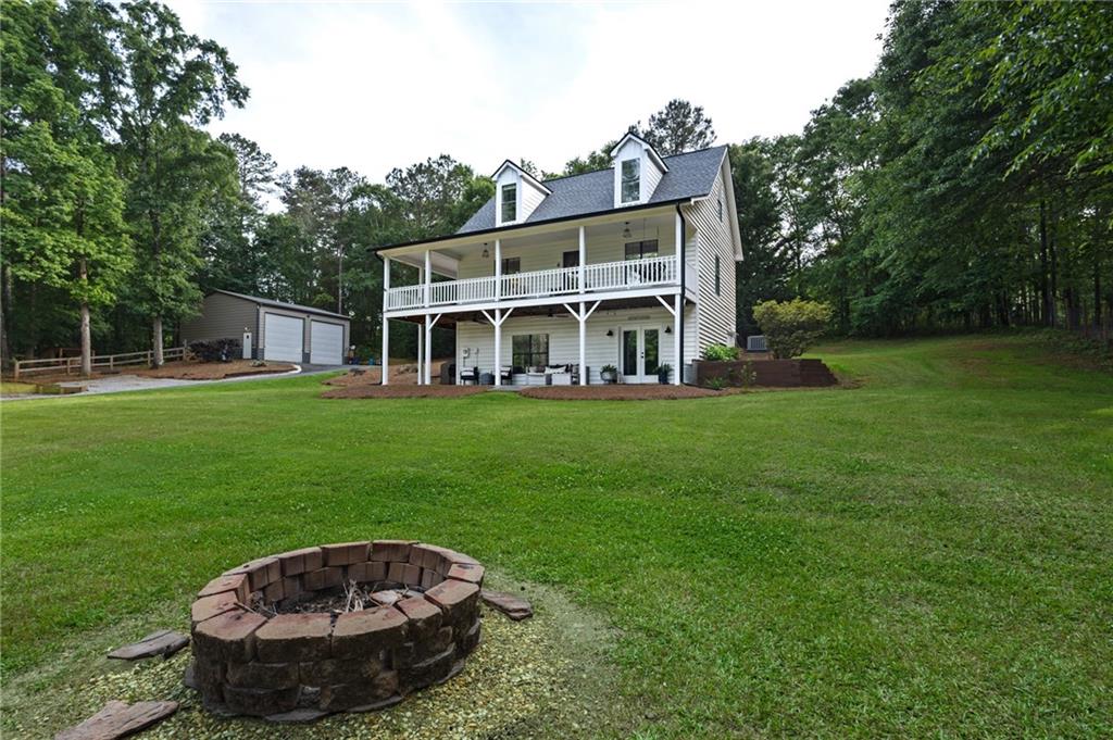 2700 Jack Glass Road Monroe, GA 30656 - Photo 3 of 48 a view of a house with a backyard porch and sitting area