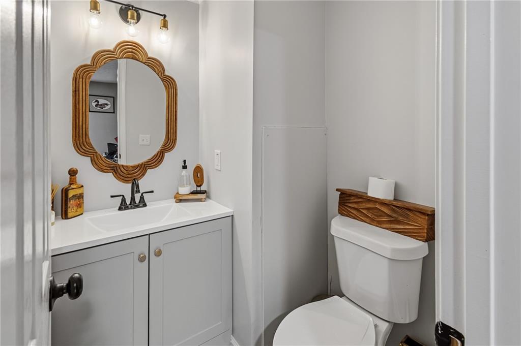 2700 Jack Glass Road Monroe, GA 30656 - Photo 34 of 48 a bathroom with a toilet sink and mirror