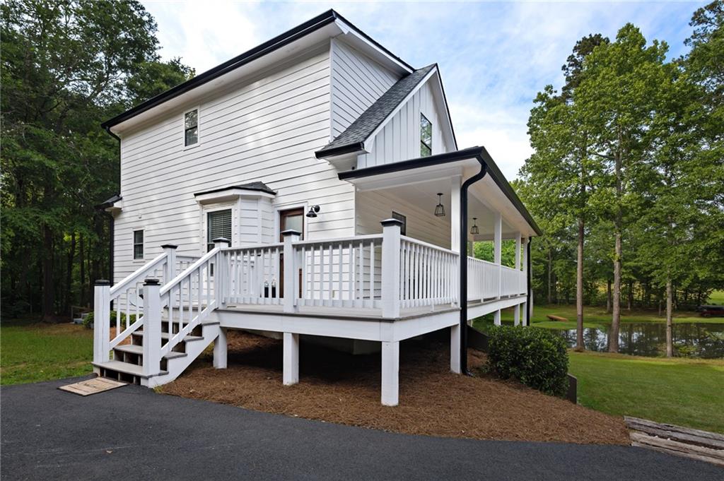 2700 Jack Glass Road Monroe, GA 30656 - Photo 41 of 48 a view of a house with a small yard and deck