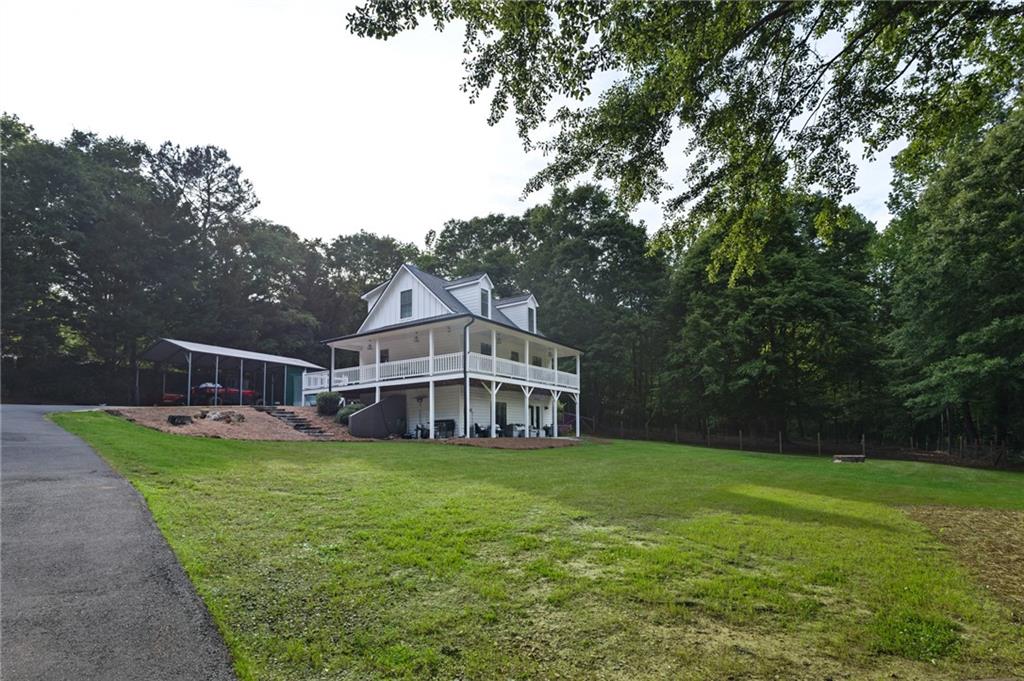 2700 Jack Glass Road Monroe, GA 30656 - Photo 44 of 48 a view of a house with a big yard and large trees