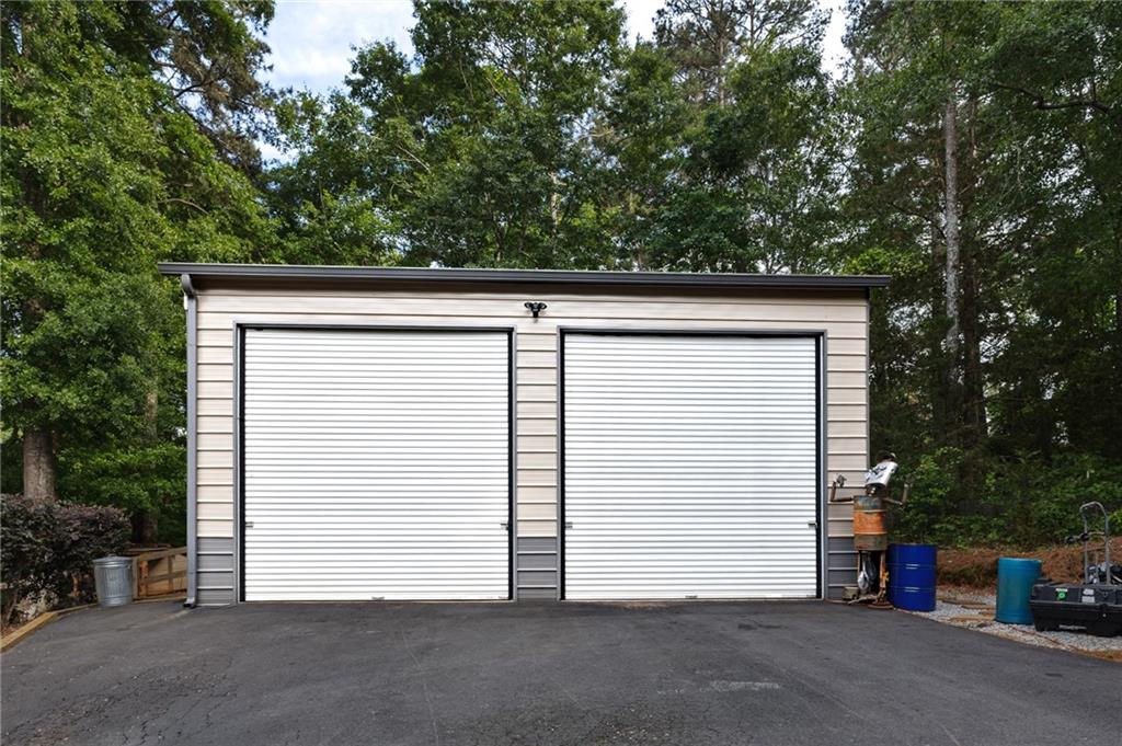 2700 Jack Glass Road Monroe, GA 30656 - Photo 46 of 48 a view of a house with a garage