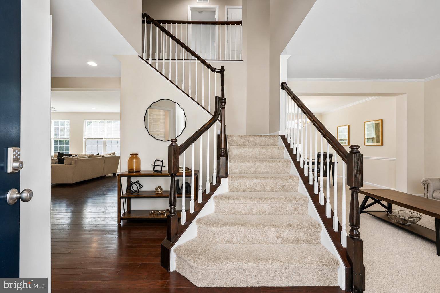 16183 Raptor Crest Lane Woodbridge, VA 22193 - Photo 4 of 51 Elegant entryway with sweeping staircase.