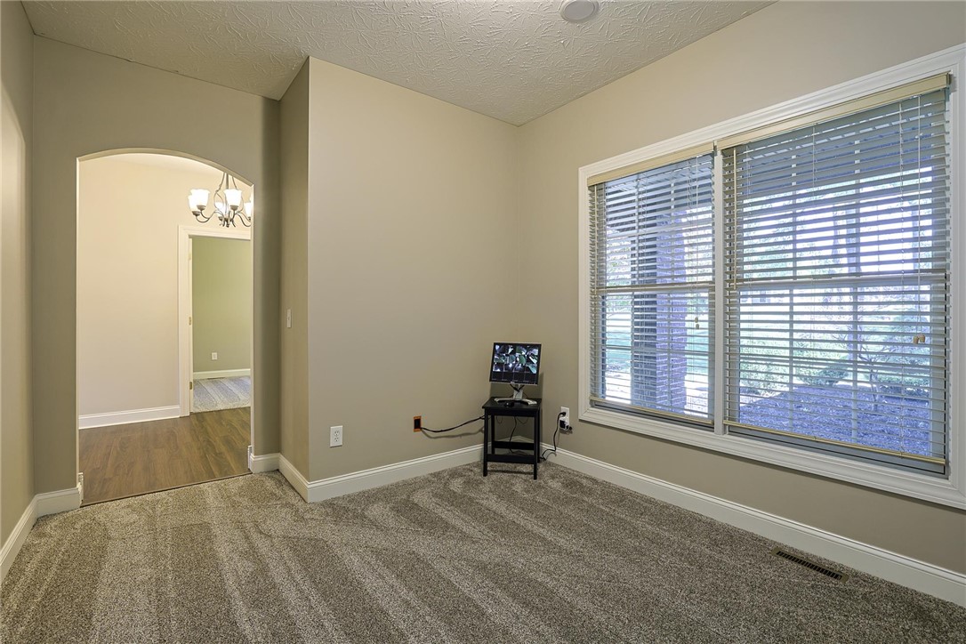 3681 Wilmington Road Lebanon, OH 45036 - Photo 19 of 87 This versatile room offers an open layout with an elegant arched doorway leading to another area.