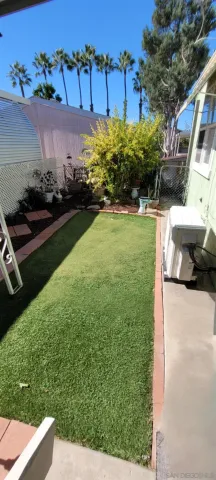 a view of a yard with an outdoor seating