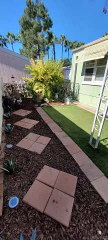 a view of a backyard of the house