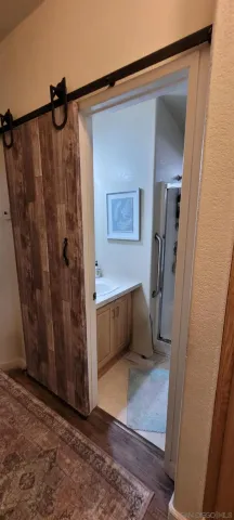 a bathroom with a shower and a tub