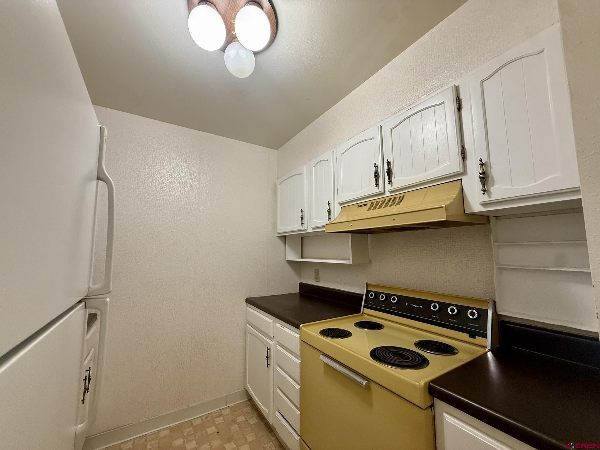 34237 Highway 550, Unit 27 Durango, CO 81301 - Photo 7 of 45 a kitchen with granite countertop a stove and a sink