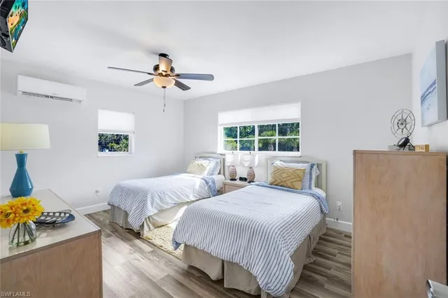 a bathroom with a sink a toilet and shower curtain