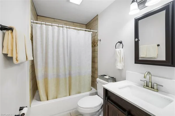 a view of a hallway with washer and dryer