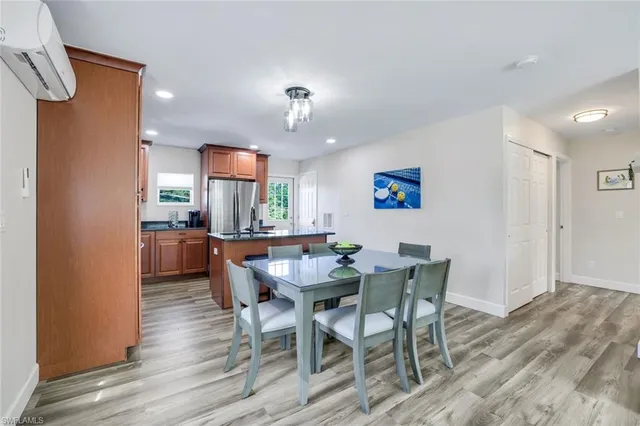 a kitchen with stainless steel appliances granite countertop a sink a stove and refrigerator