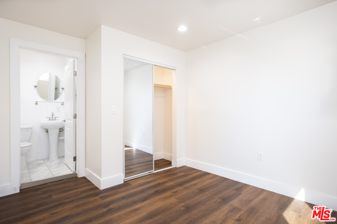 628 Silver Boulevard Los Angeles, CA 90026 - Photo 15 of 22 a view of a hallway with wooden floor