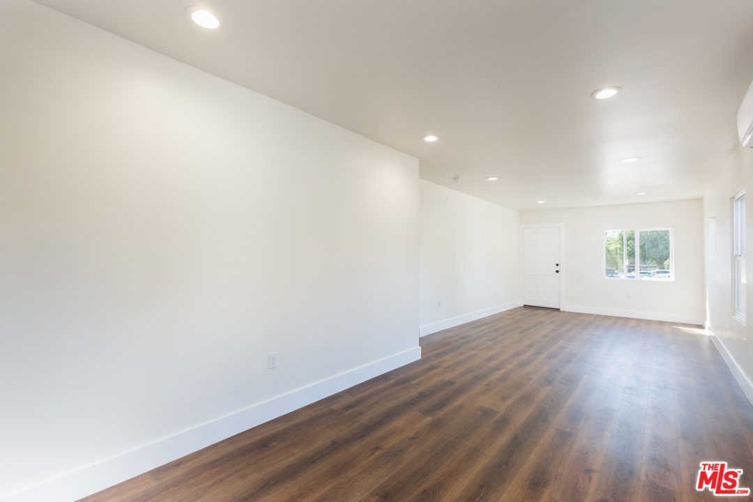 628 Silver Boulevard Los Angeles, CA 90026 - Photo 5 of 22 an empty room with wooden floor and windows
