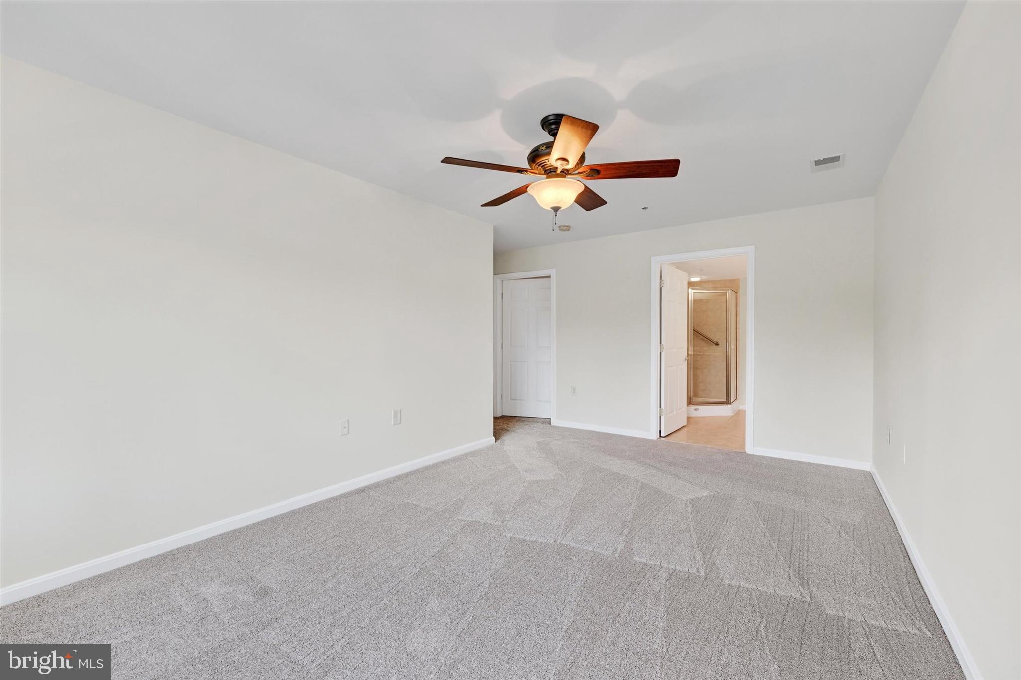 12236 Roundwood Road, Unit 104 Lutherville-Timonium, MD 21093 - Photo 22 of 27 a view of an empty room